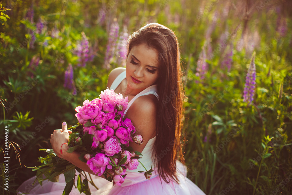 beautiful brunette holds a large bouquet of flowers beautiful brunette holds a large bouquet of flowers