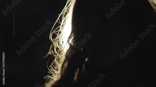 Glow-haired girl at the evil night close-up