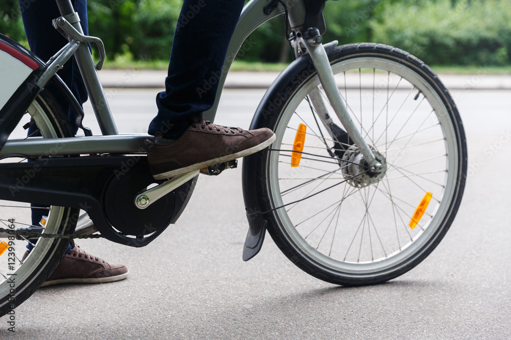 Man sitting on bicycle. Image without face Man sitting on bicycle. Image without face