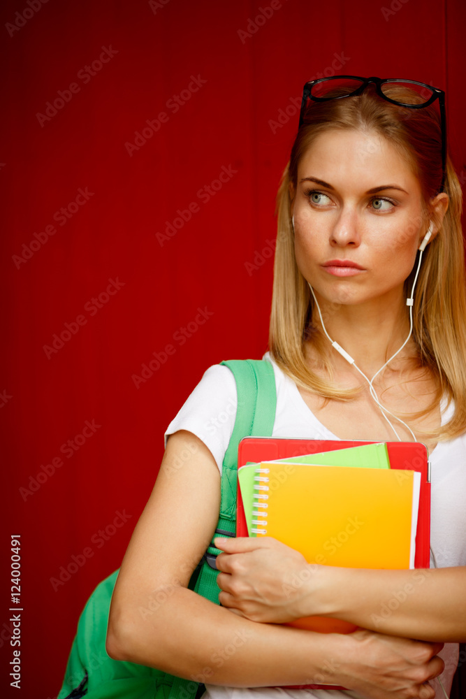 Serious girl with sunglasses on empty Brown background Serious girl with sunglasses on empty Brown background