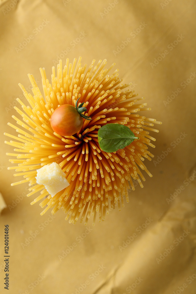 Raw spaghetti with tomato and cheese Raw spaghetti with tomato and cheese