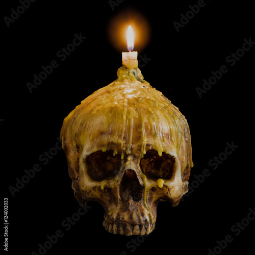 skull with candle light on top with clipping path on black backg