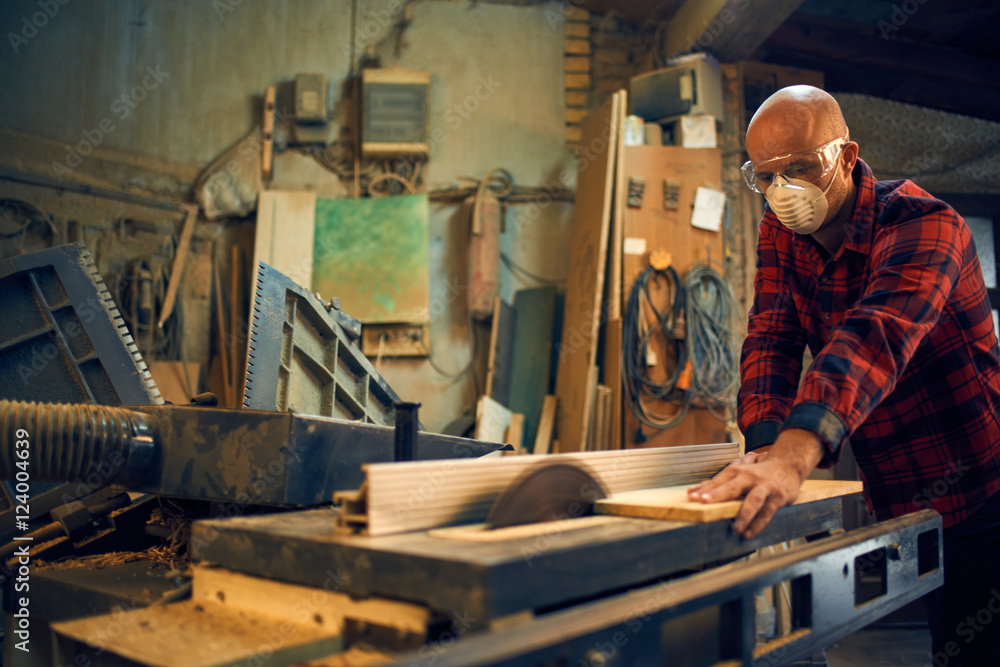 Carpenter at work at his workshop Carpenter at work at his workshop