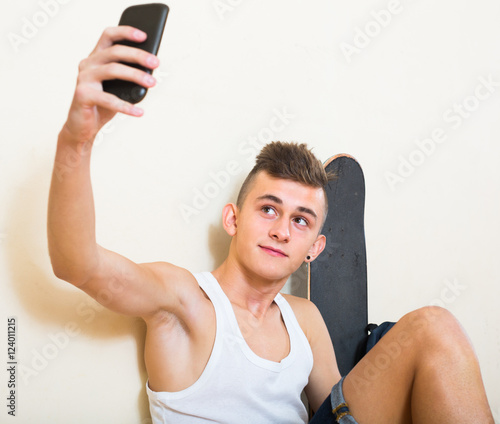 guy doing selfie on smartphone