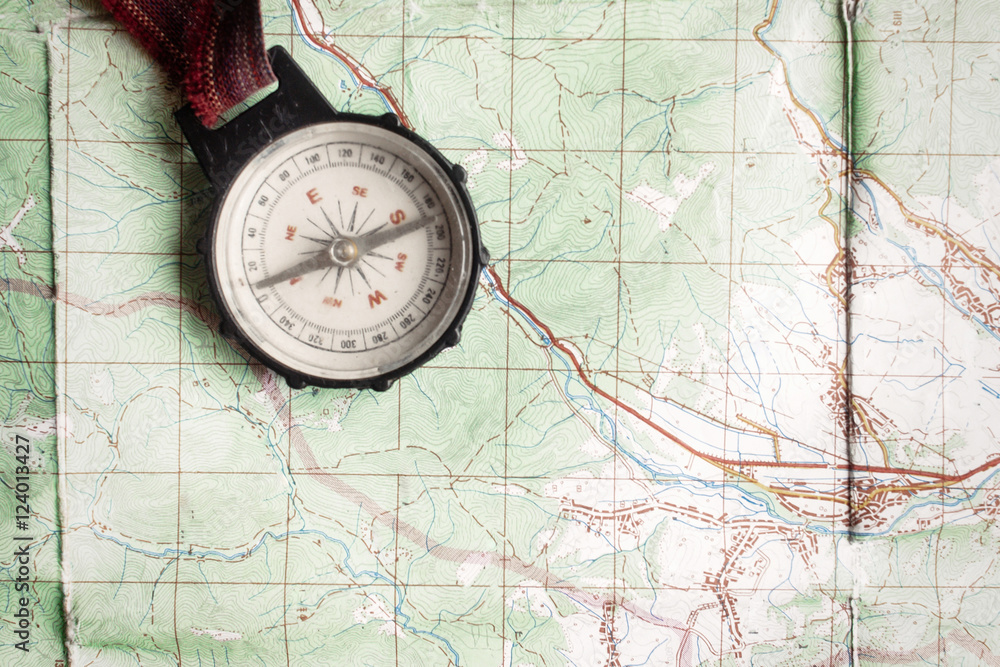 wanderlust and explore concept, old compass lying on map, top vi wanderlust and explore concept, old compass lying on map, top vi