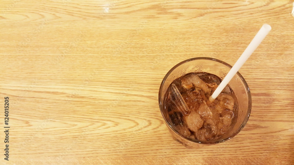 Glass of beverage on table. Glass of soft drink on table Glass of beverage on table. Glass of soft drink on table