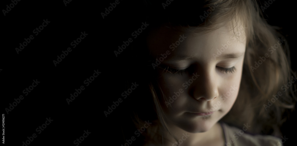 Portrait of a young girl on black background Portrait of a young girl on black background