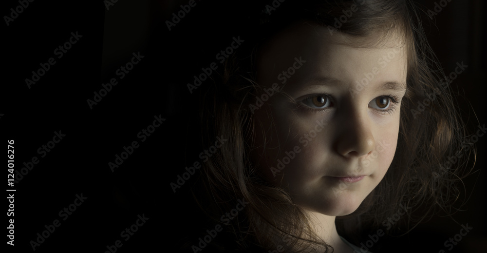 Portrait of a young girl on black background Portrait of a young girl on black background