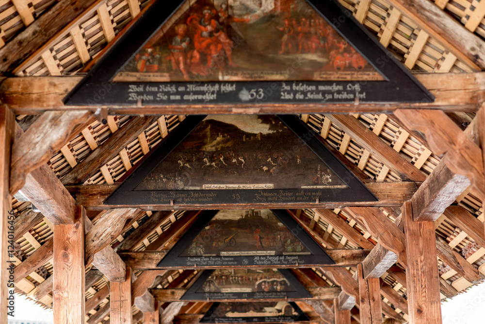 Ancient paintings on the oldest wooden bridge in Lucerne city in Switzerland