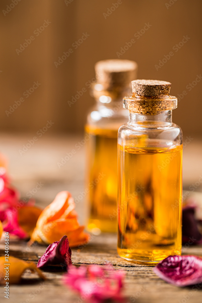 bottle of aroma essential oil or spa and natural fragrance oil with dry flower on wooden table, image for aroma spa alternative therapy medicine and meditation aroma concept.
bottle of aroma essential oil or spa and natural fragrance oil with dry flower on wooden table, image for aroma spa alternative therapy medicine and meditation aroma concept.