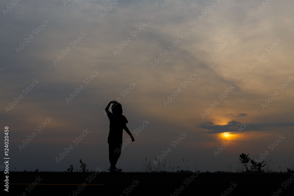 Silhouette girls on holiday. she is happy to be running and jump