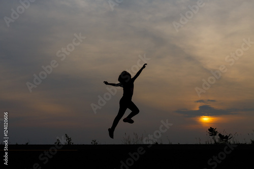 Silhouette girls on holiday. she is happy to be running and jump