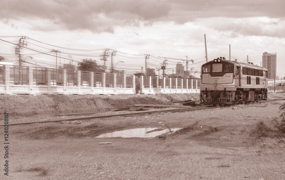 Construction site / View of train run in construction site. Motion blur filter. Sepia tone.