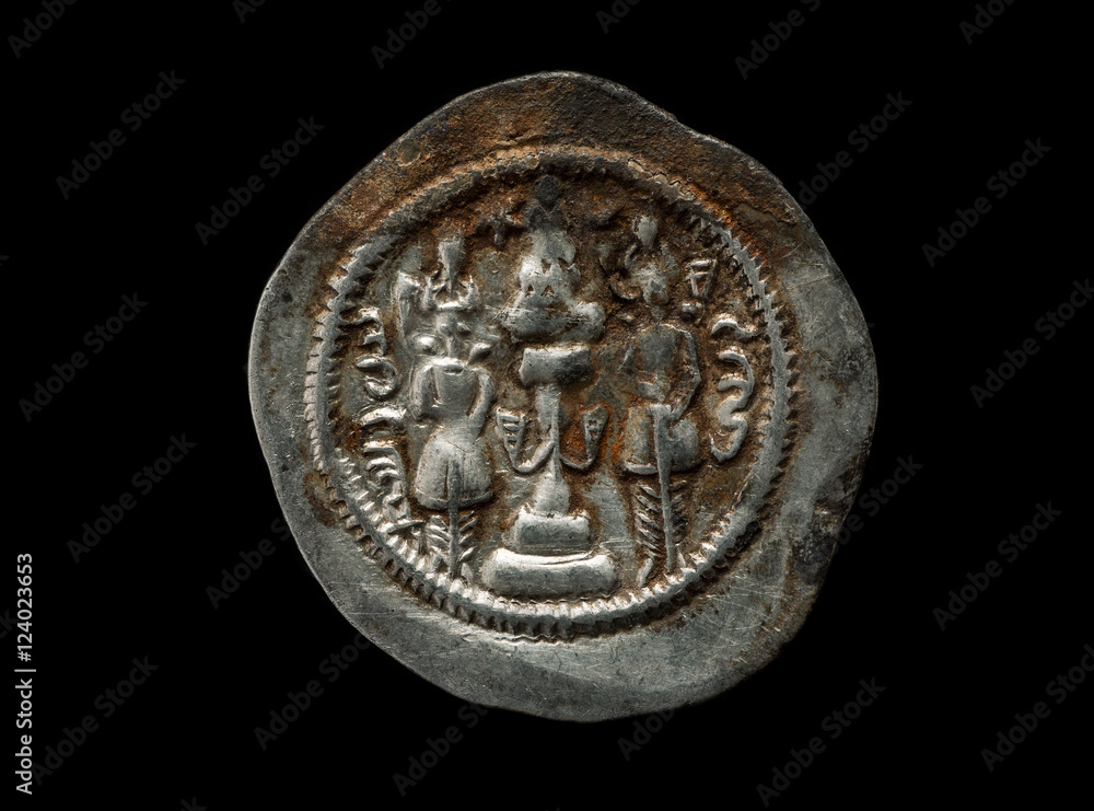 Ancient silver Sassanian coin isolated on black
