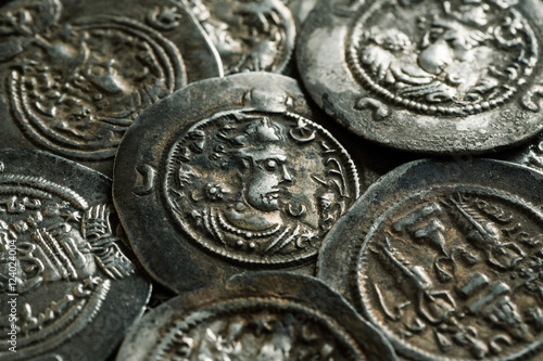 Pile of ancient silver coins close-up photo