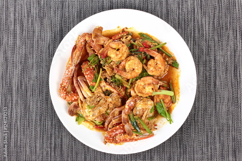 Stir-fried crab and shrimp in curry power is top-ten of popular Thai food as seafood to fried with fresh milk ,grill curry ,egg ,oyster oil and yellow curry powder. 