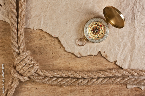 compass, old paper and rope