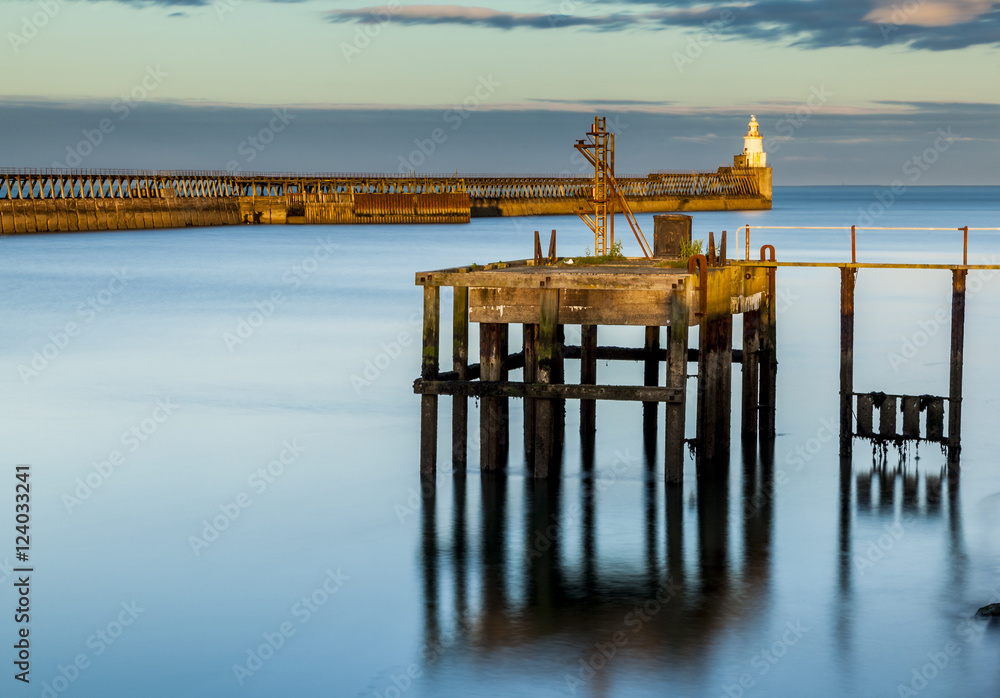 Blyth Harbour, Northumberland, England, UK. At sunset. View looking towards harbour entrance from North Sea.