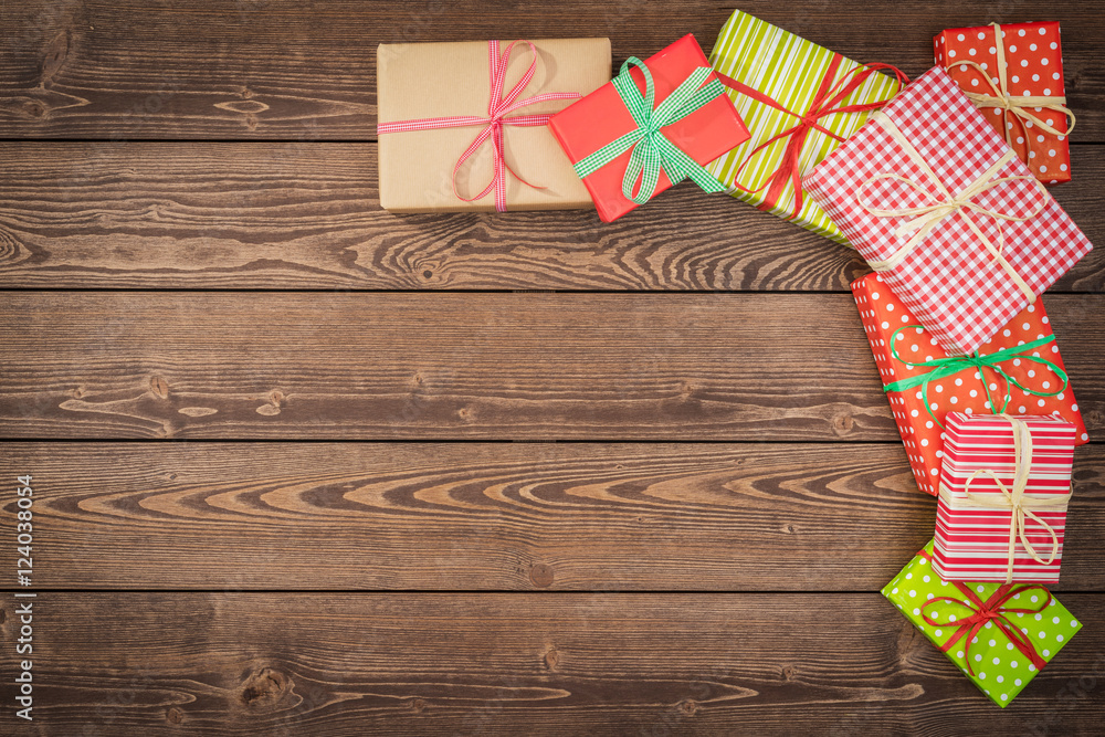 Fototapeta premium Colorful christmas presents on wooden table