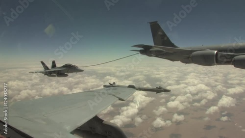 F/A-18 fighter jet refuels during flight. photo