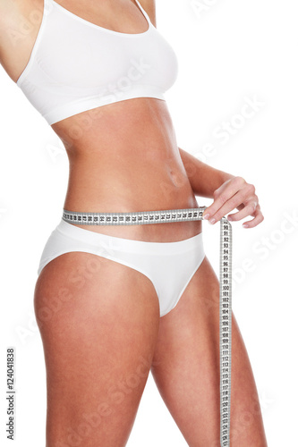 Slim woman with a tape measure