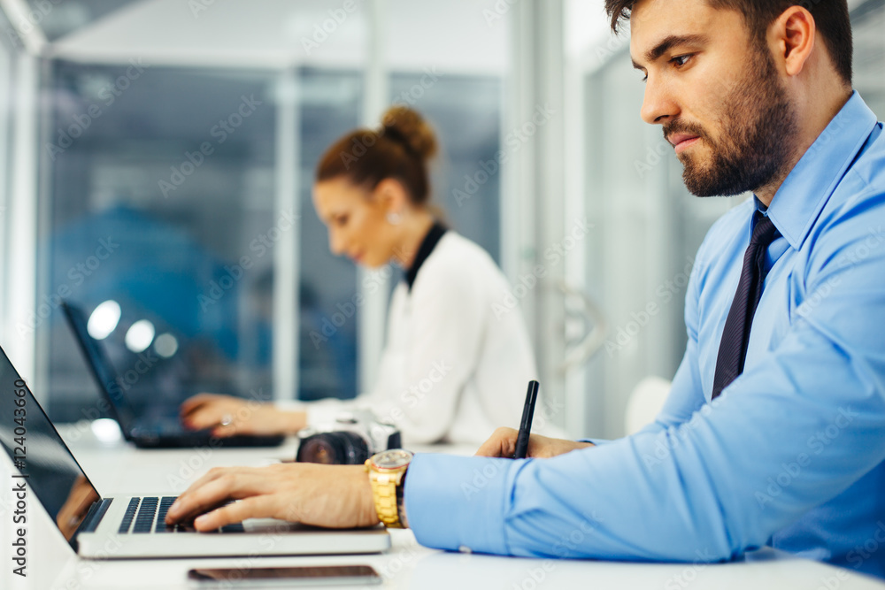 Businessman working on laptop and written Businessman working on laptop and written