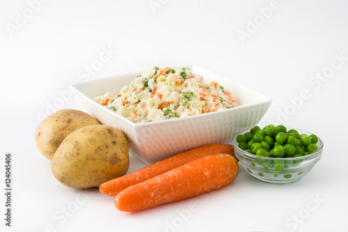 Russian salad and ingredients isolated on white background

