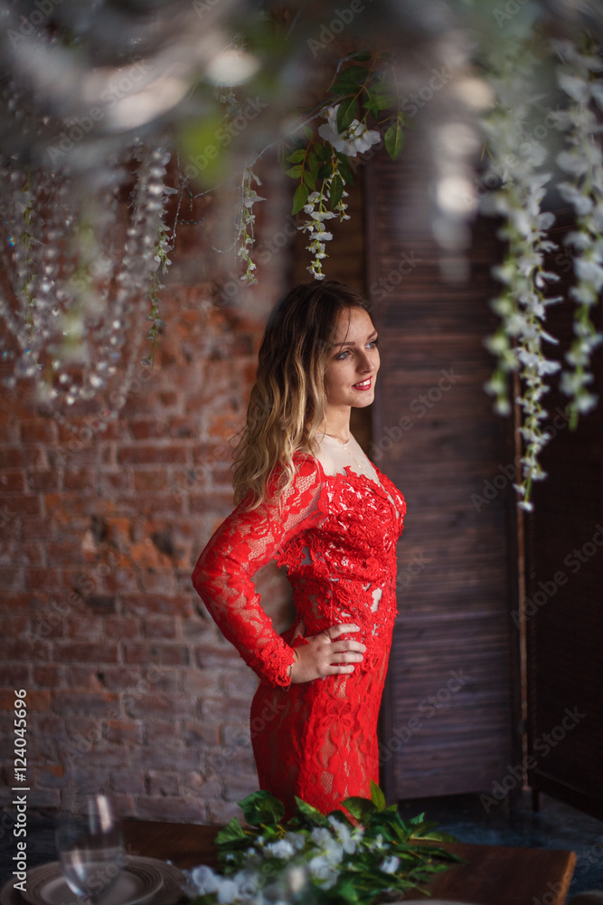 Girl in red dress enthralling