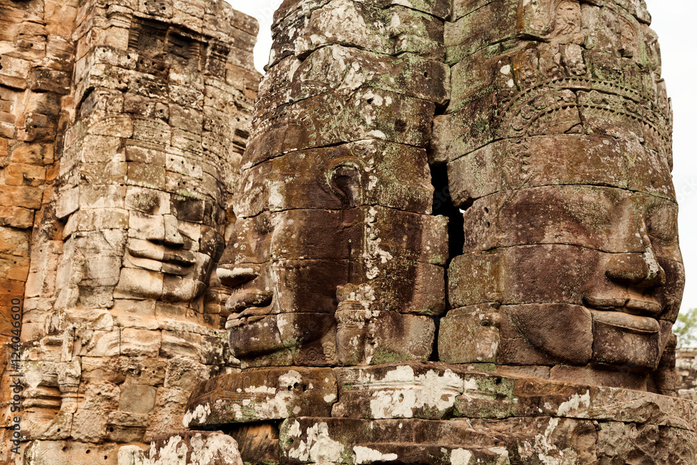 Three faces in Bayon Temple at daylight, Angkor Wat, Cambodia