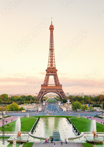 Eiffel Tower shot from Trocadero at sunset. Pond and gardens on