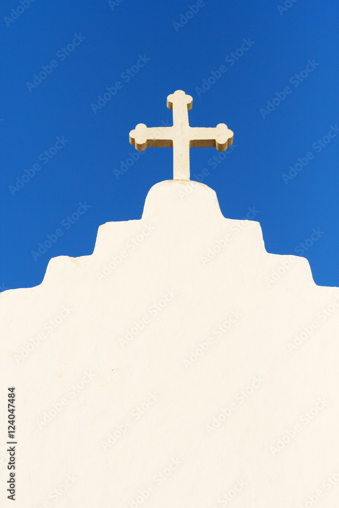 Details of white church cross in Mykonos, Greece. Vertical shot Details of white church cross in Mykonos, Greece. Vertical shot