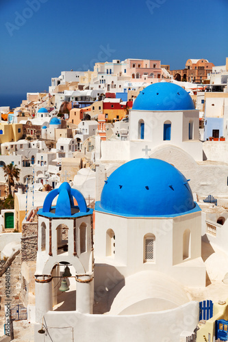 Landscape of Oia town in Santorini, Greece with blue dome church