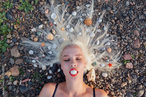 Young woman with seahells in hair. photo