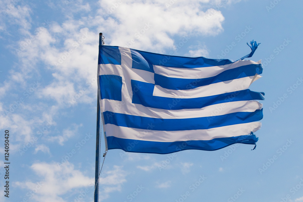 Obraz premium Greece flag against blue sky with white clouds