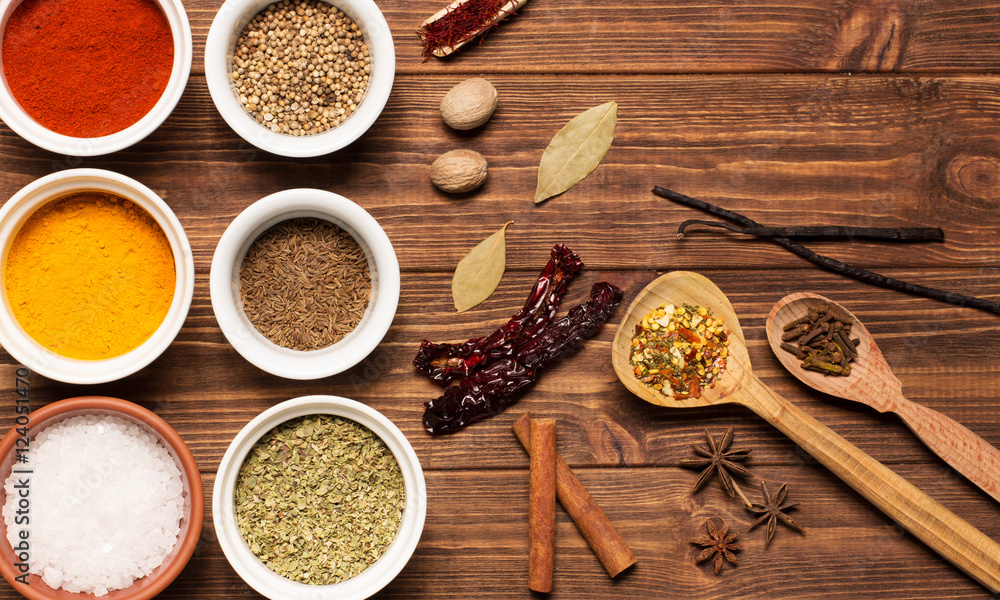 Spices on brown rustic wooden background, soft focus, horizontal
Spices on brown rustic wooden background, soft focus, horizontal