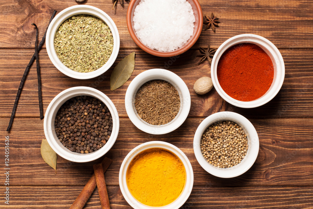 Spices on brown rustic wooden background, soft focus, horizontal
Spices on brown rustic wooden background, soft focus, horizontal