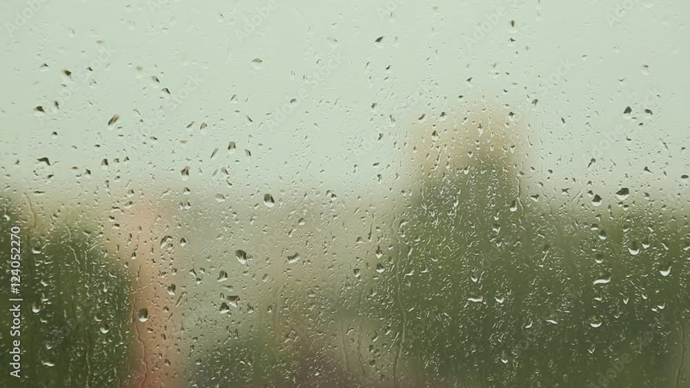 The raindrops flowing on glass windows in rainy weather. The raindrops flowing on glass windows in rainy weather.