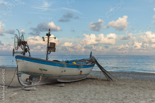 Fishing boat on the beach photo