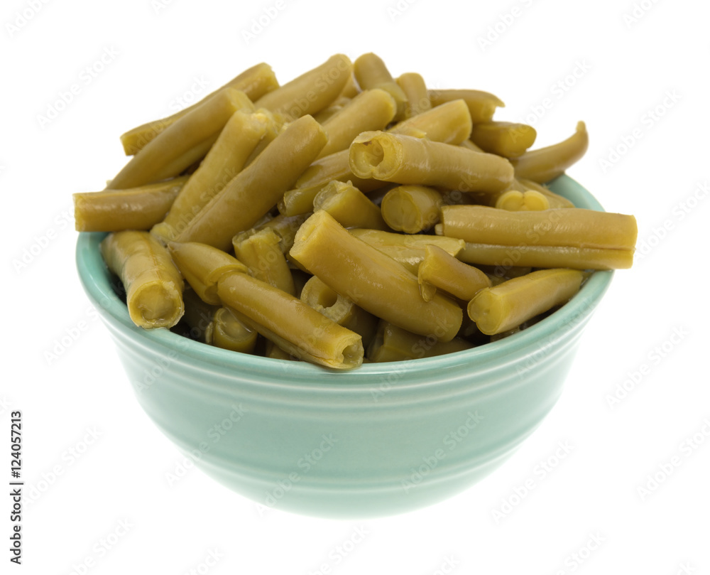 Organic cut green beans in a bowl isolated on a white background. Organic cut green beans in a bowl isolated on a white background.