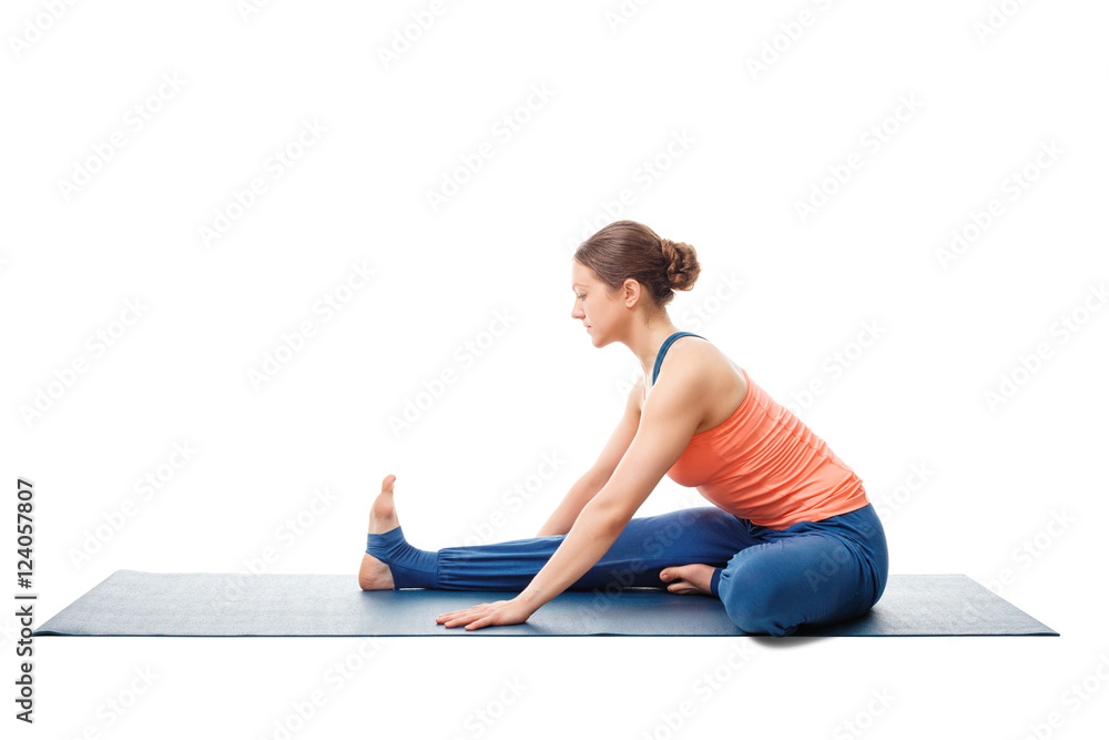 Woman doing Ashtanga Vinyasa Yoga asana Janu sirsasana Woman doing Ashtanga Vinyasa Yoga asana Janu sirsasana