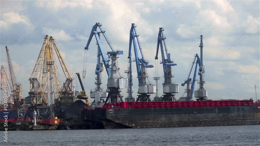 Port viewa. Many large cranes transshipped coal in the port. Port viewa. Many large cranes transshipped coal in the port.