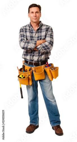 Full-length construction worker contractor carpenter with arms crossed isolated on white background for use alone or as a design element