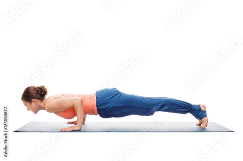 Woman doing Ashtanga Vinyasa Yoga asana Chaturanga Dandasana