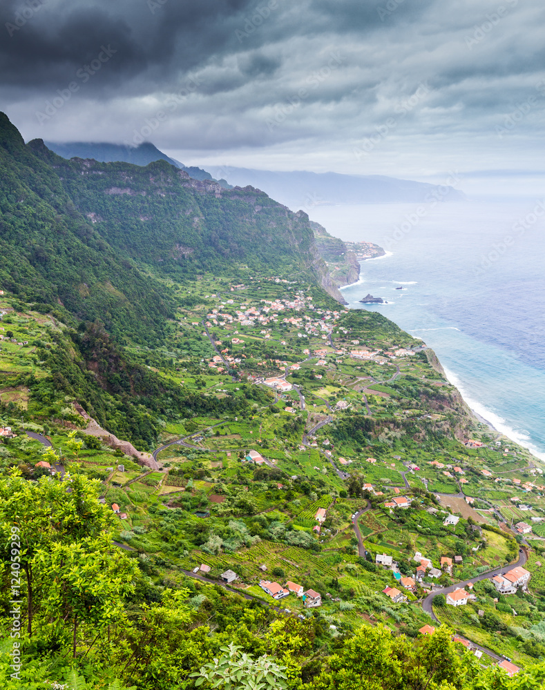 Coast with small village on Madeira island, Portugal