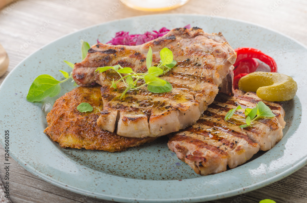 Grilled pork chops with herbs and garlic, potato pancakes