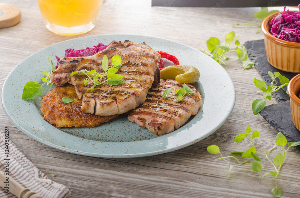 Grilled pork chops with herbs and garlic, potato pancakes Grilled pork chops with herbs and garlic, potato pancakes