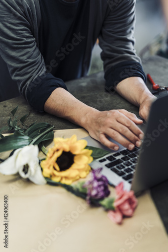 male florist working in flower shop