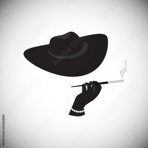 The strange lady in a hat holding a cigarette in the mouthpiece. A woman in a mafia style