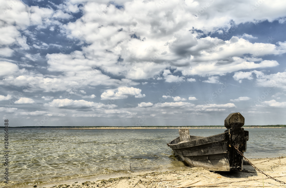 Wooden boat on the sandy beach