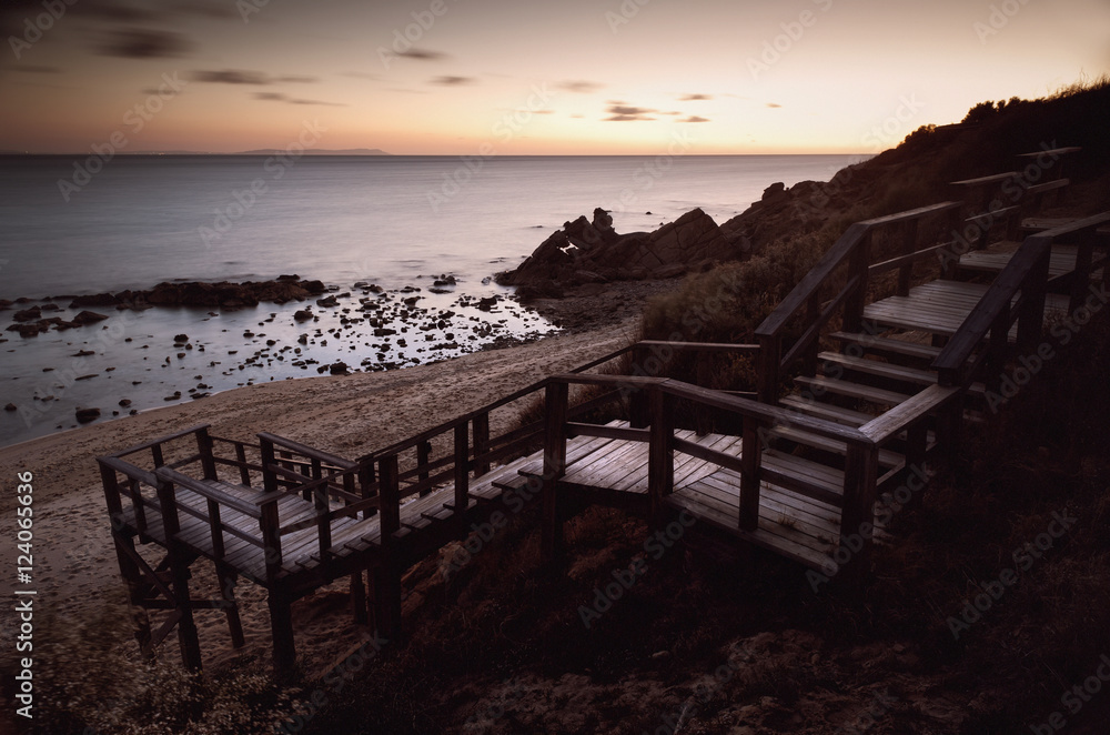 A Wooden Staircase Leading Down To The Beach; Tarifa, Cadiz, Andalusia, Spain A Wooden Staircase Leading Down To The Beach; Tarifa, Cadiz, Andalusia, Spain